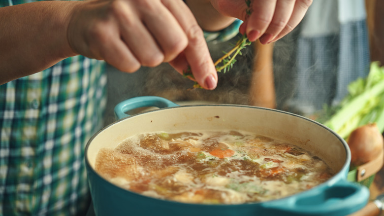 Person cooking soup