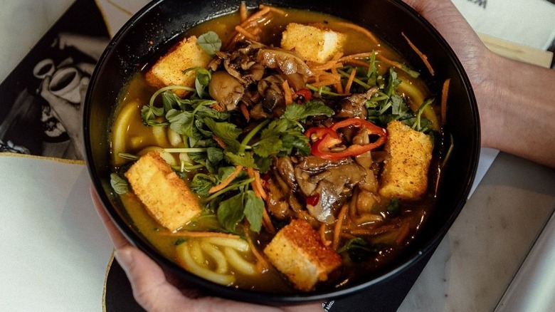 bowl of broth, soba, and tofu