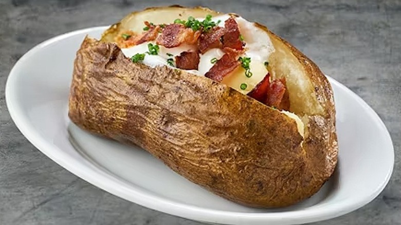 Loaded baked potato on plate