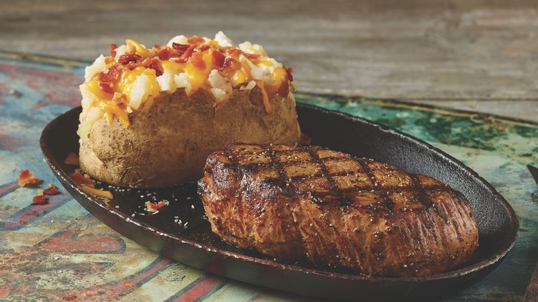 Grilled steak and loaded baked potato