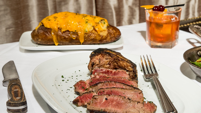 Cut steak with loaded potato