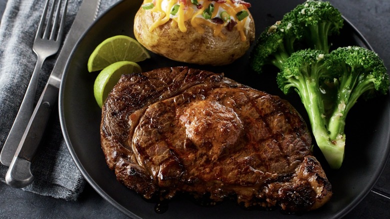 Grilled steak, broccoli, baked potato