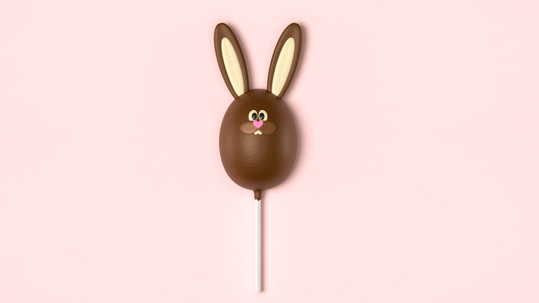 Easter lollipop on pink background