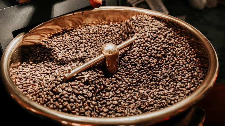 A machine cools roasted coffee beans.