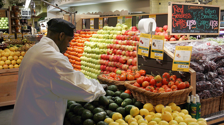 Man stocking fruit