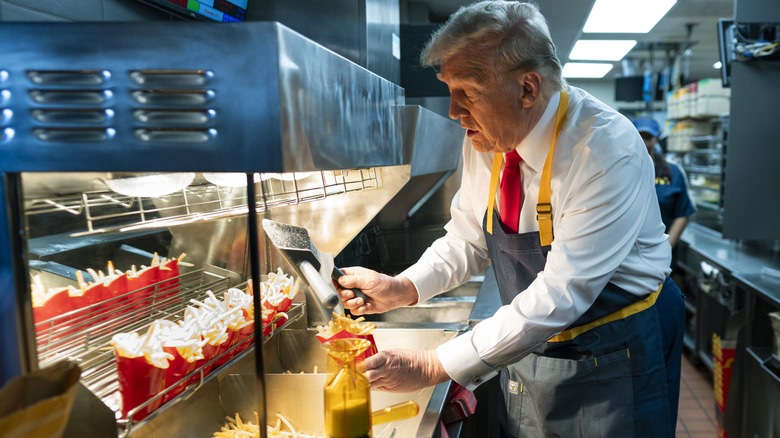 Donald Trump filling french fry containers at McDonald's