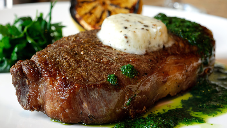 steak topped with butter