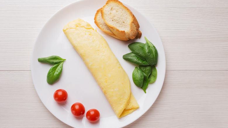 French omelet with basil, tomato, and bread