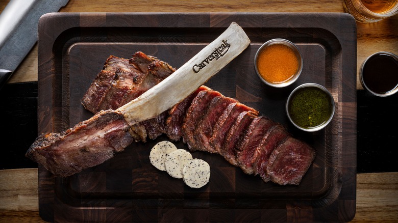 Rare sliced steak on a board