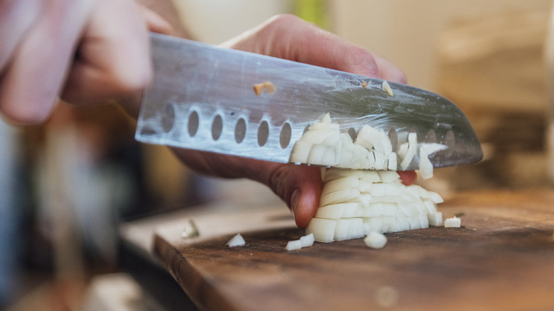 Person chopping onions