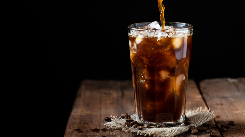 pouring coffee over ice