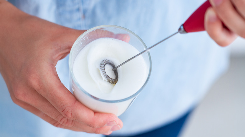 frothing milk using hand frother