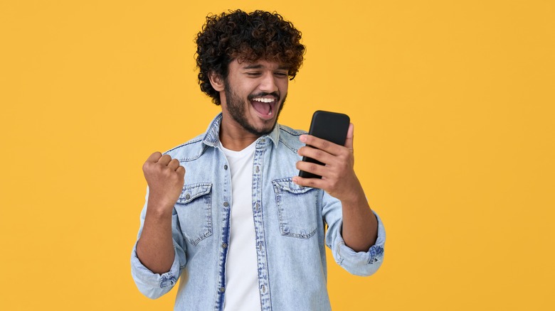 Excited man on his phone