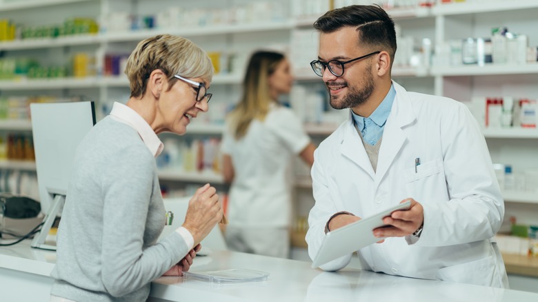 Woman filling pharmacy prescription