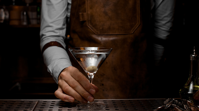 bartender holding marini glass