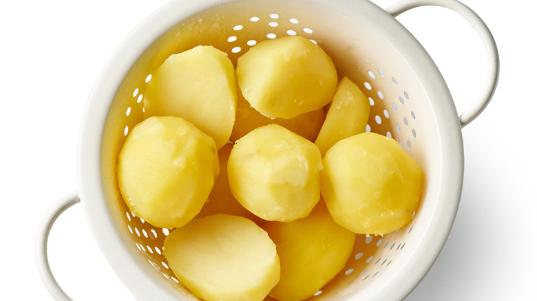 Boiled potatoes in strainer