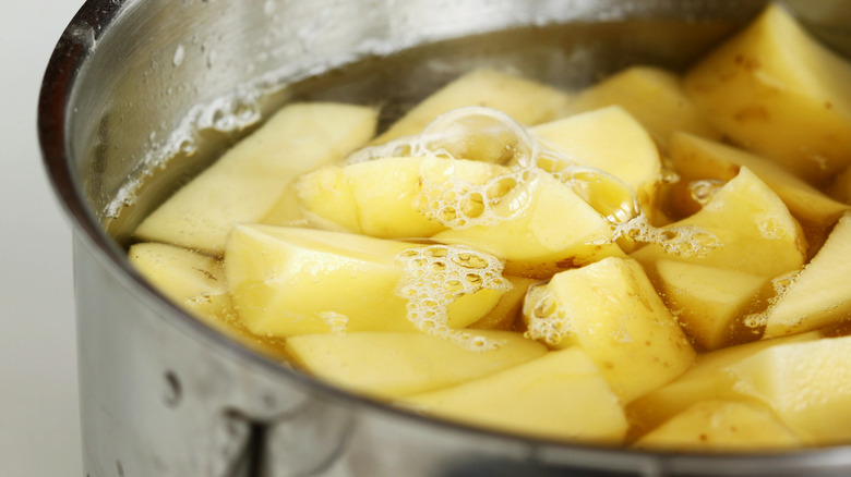 Potatoes cooking in pan