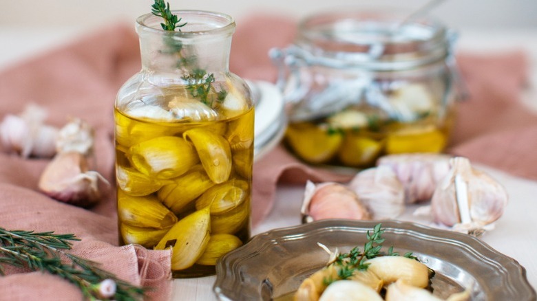 Garlic confit in glass jar