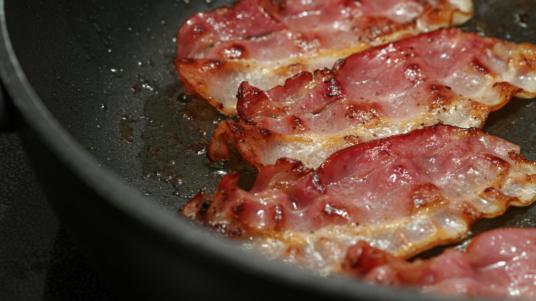 Bacon cooking on a stove