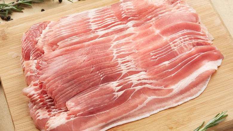 Uncooked bacon sitting