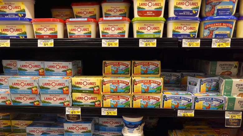 butter brands on refrigerated shelf