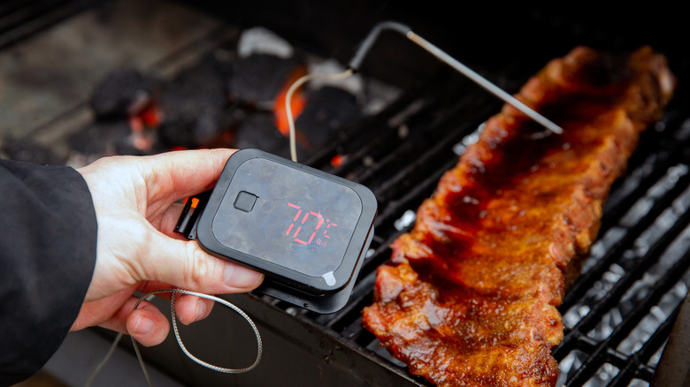 Ribs with a digital thermometer