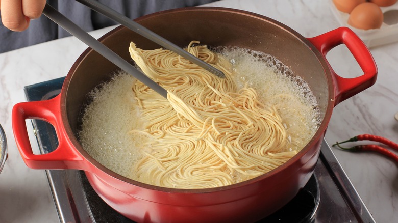 Egg noodles being cooked 