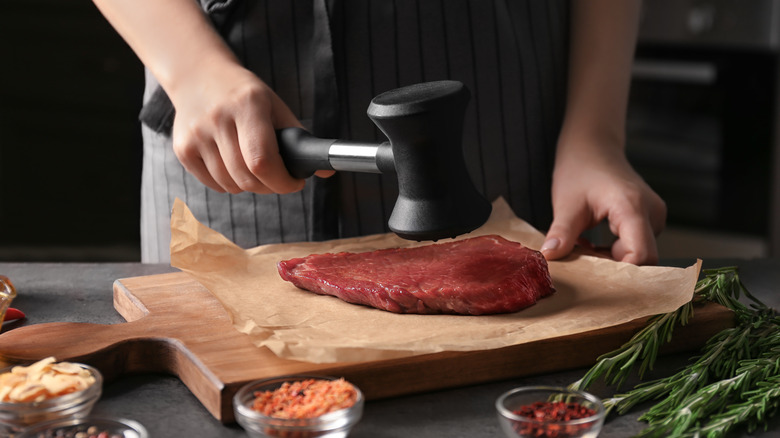 Tenderizing steak with a mallet