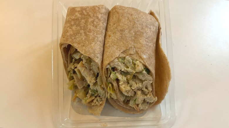 trader joes tarragon chicken salad wrap on white table