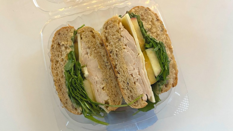 trader joes turkey apple cheddar sandwich on white table