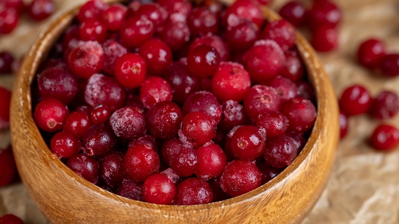 Fresh cranberries in wooden bowl