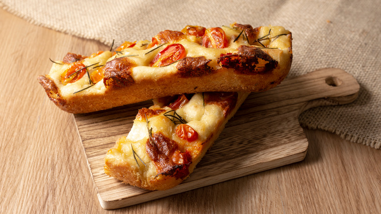 Focaccia pizza slices cutting board