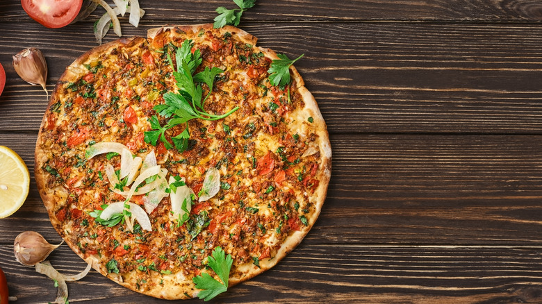 Lahmacun pizza pie wooden table