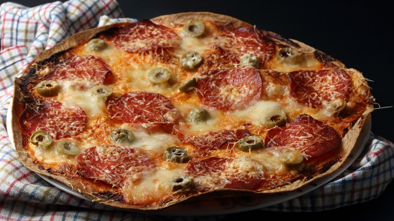 Lavash pizza with salami and olives