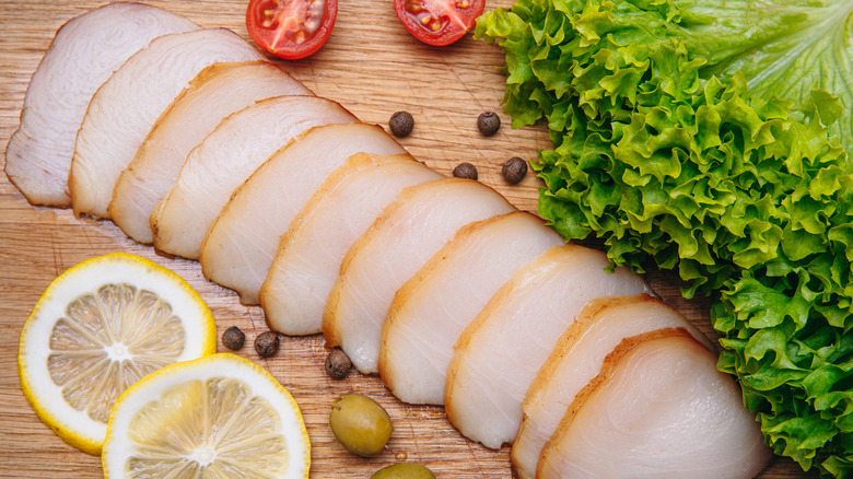 Sliced escolar and lettuce