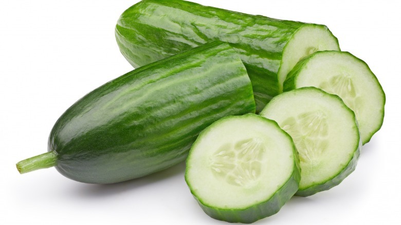 sliced cucumbers on white background