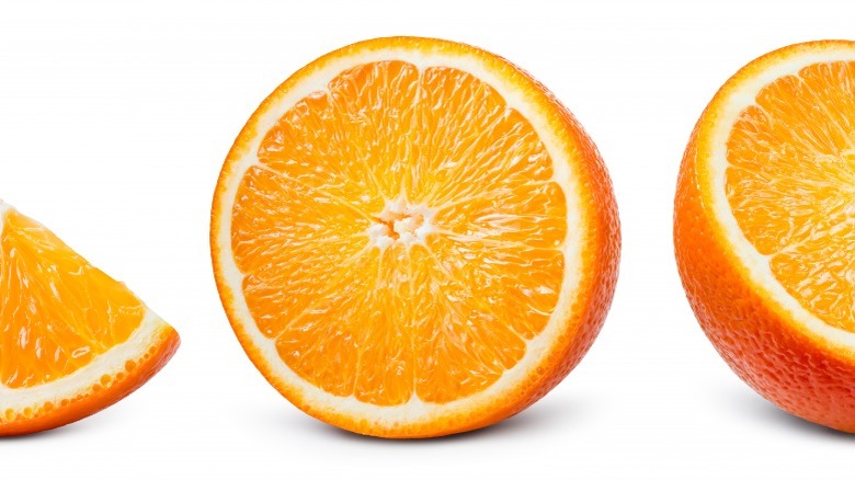 Sliced oranges on white background