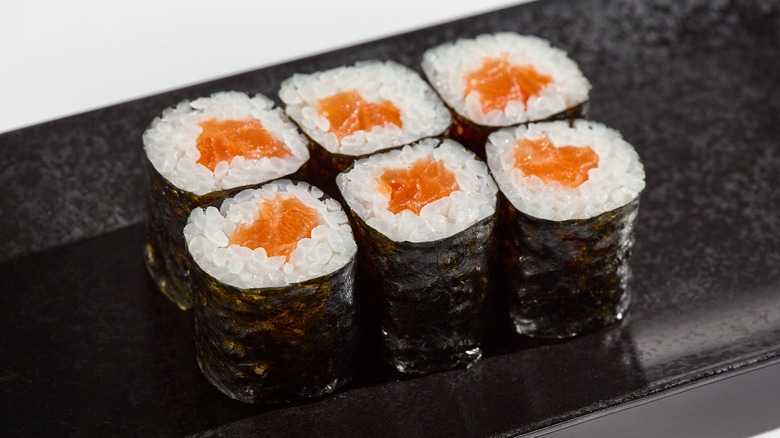 Six salmon hosomaki sushi rolls