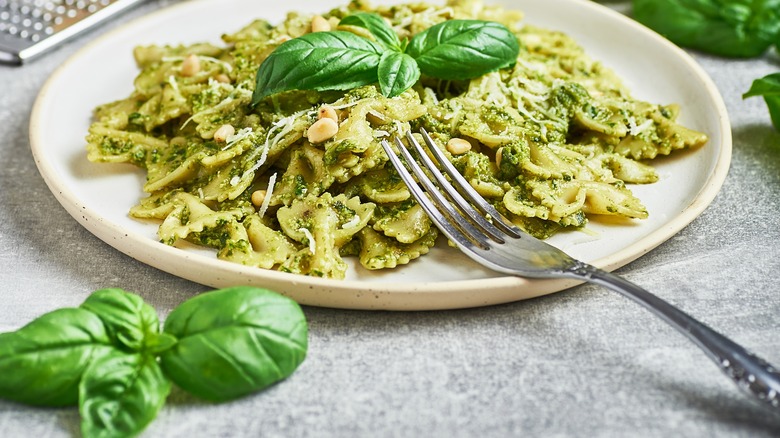 Pesto pasta on white plate