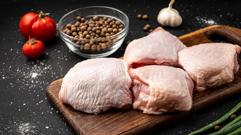 Chicken thighs on cutting board