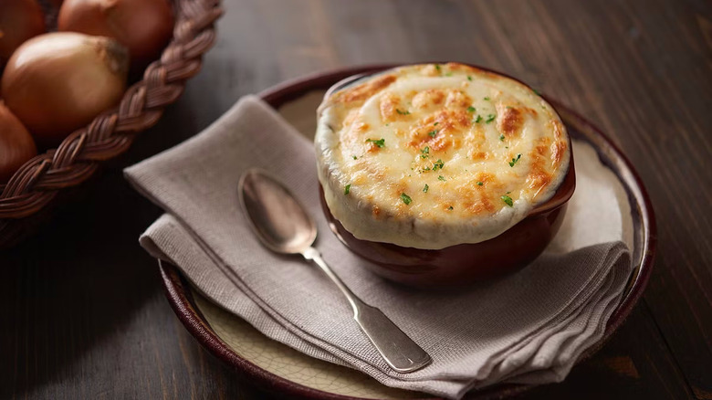 Crock of cheesy French onion soup