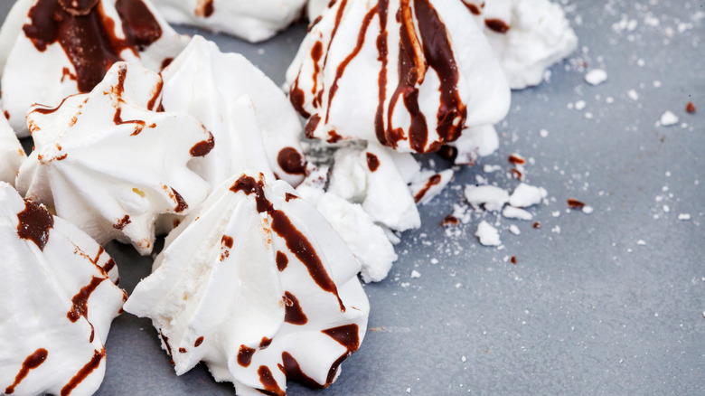 white meringues drizzled with chocolate