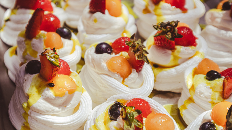 mini pavlovas filled with cream and berries