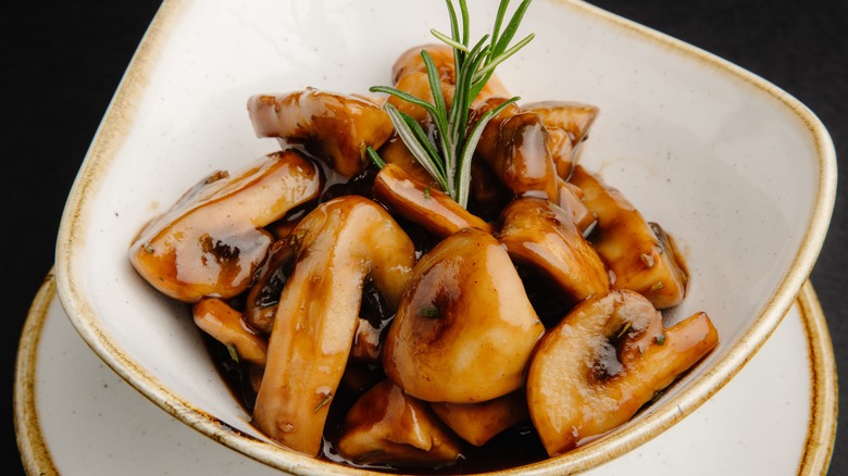 Sautéed mushrooms in white bowl