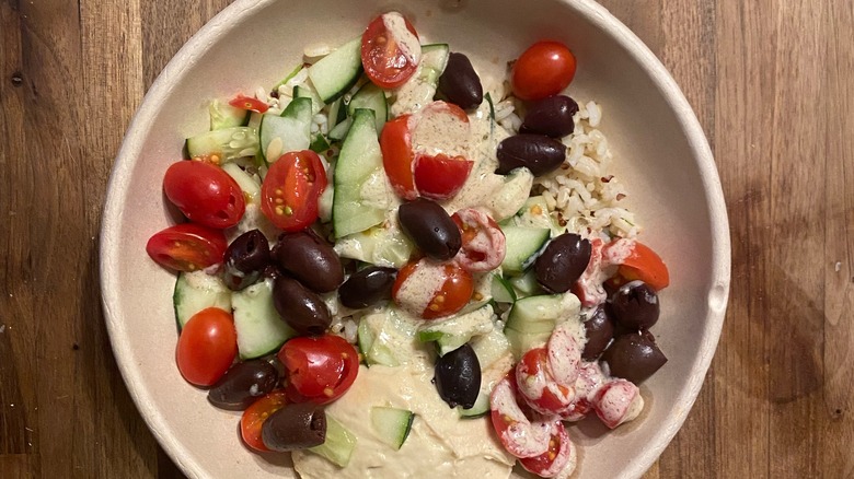 Bowl with dressing and hummus