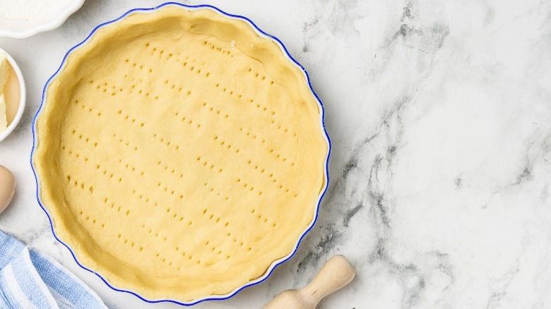 Uncooked pie crust on counter