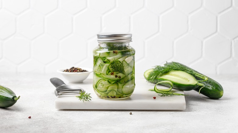 Jar of sliced pickled cucumbers