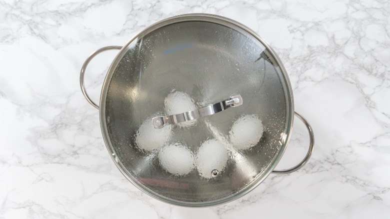 A pot of boiling eggs