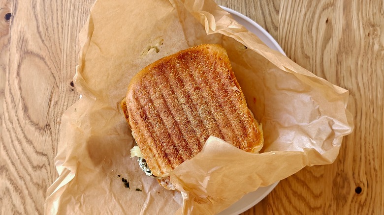 panini sandwich wrapped in parchment paper