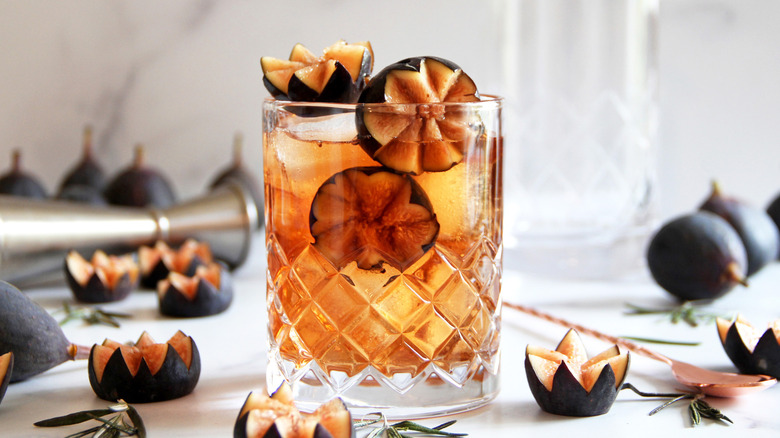 cocktail garnished with cut figs